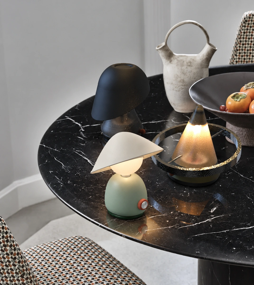 Mori, Sway and Halo glowing on a black marble table